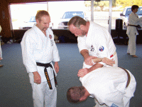 Shipes Sensei demonstrating a restraint